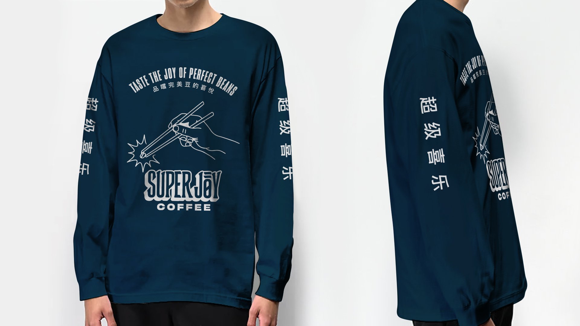 A person wears a long-sleeved navy Super Joy shirt. The front reads “Taste the joy of perfect beans” with Chinese characters and a hand, chopsticks, and coffee bean. The sleeves also feature Chinese symbols.